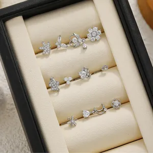 Close-up of silver titanium steel ear piercings set with clear zirconia in jewelry box