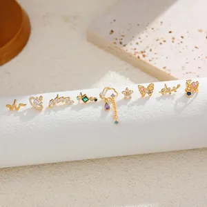 Set of nine 18K gold plated titanium steel ear studs with colorful zircons.