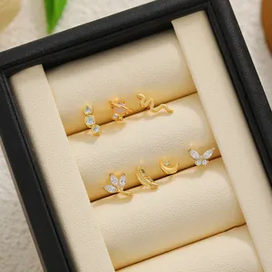 Detail shot of 18K gold-plated titanium steel ear studs set with micro-set zircon crystals.
