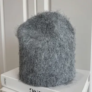 Detail view showing the soft fuzzy texture of this gray mohair-style winter beanie