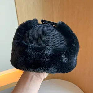 Classic black corduroy ushanka winter hat featuring soft faux fur lining for men and women