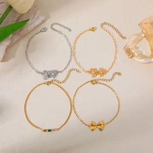 Elegant 18K gold plated stainless steel bracelets featuring flower, bow, and stone charms