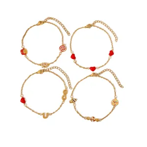 Set of four 18K gold plated stainless steel bracelets with heart and U-shaped charms