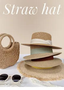 Selection of flat top woven straw hats with colorful ribbons for summer beach sun protection.