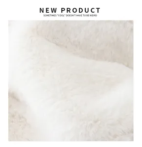 Close-up detail of the thickened white faux fur material for a winter warm hat