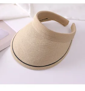 Detail showing the woven straw texture of a khaki empty top sun visor hat.