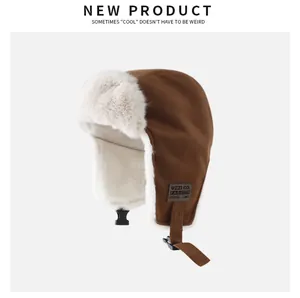 Brown winter trapper hat featuring warm cream faux fur lining and adjustable chin strap