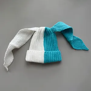Detailed view of the blue and white split-color knitted texture and long bunny ears.