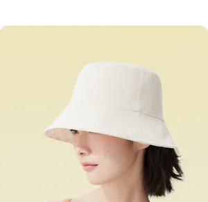 Close-up of a stylish wide brim bucket hat with plaid lining for summer sun protection.