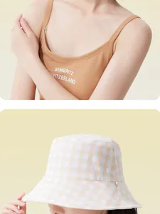 Close-up of women's orange gingham wide brim bucket hat for summer sun protection