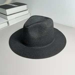 Detailed view of a classic black woven Panama hat for sun protection and summer beach style