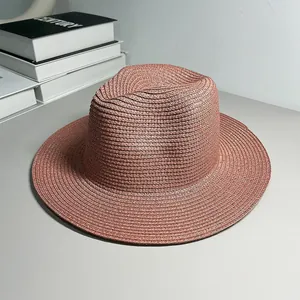 Elegant terracotta Panama straw hat for sun protection, perfect for beach and summer travel.