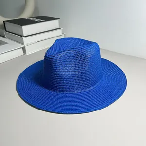 Detailed macro shot of a vibrant blue straw Panama hat with classic Jazz style brim.