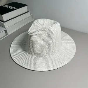 Close-up view of a classic white Panama straw hat for summer sunshade and beach style.