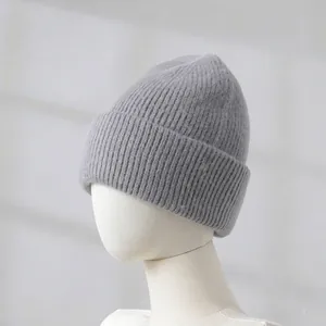 Detailed macro view of the soft gray rabbit fur knit beanie texture