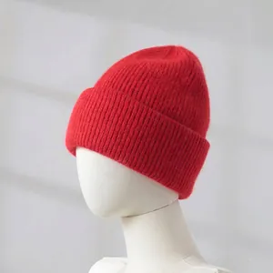 Detailed view of a thick red rabbit hair knit beanie shown on a mannequin head
