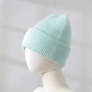 Soft mint green ribbed knit rabbit hair beanie shown on a professional white mannequin head