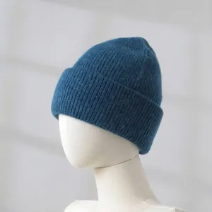 Detailed view of soft blue rabbit hair knitted beanie showing the thick fuzzy texture