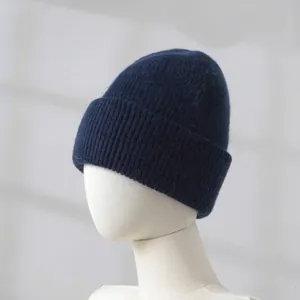 Close-up detail of thick navy blue rabbit fur knit beanie shown on mannequin head