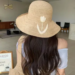 Handmade raffia straw sun hat with white tulip embroidery for summer beach vacation