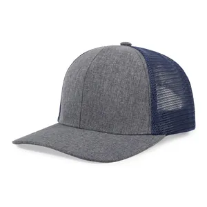 Detailed side view of a stylish two-tone grey and navy blue mesh trucker baseball cap