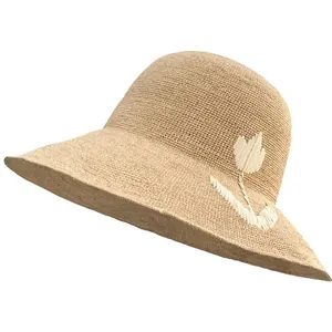 Handmade raffia straw sun hat for women with elegant white floral embroidery detail