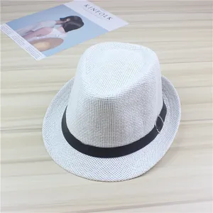 Detailed macro view of the white woven straw fedora hat with black ribbon buckle.