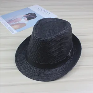 Close-up of a stylish black woven straw fedora hat with an elegant leather band