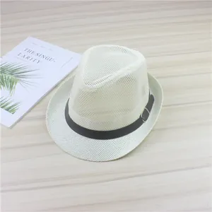Stylish breathable white mesh fedora hat with a black belt detail on a wooden surface