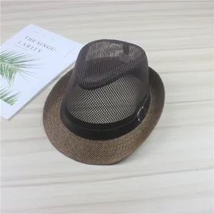 Detailed view of a brown woven jazz sun hat with a breathable mesh top and leather band.