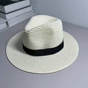 Detailed view of the woven straw texture and black ribbon on a classic Panama sun hat
