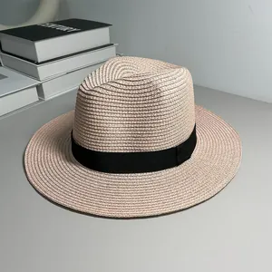 Detailed view of the woven straw texture on a classic beige Panama hat with black band
