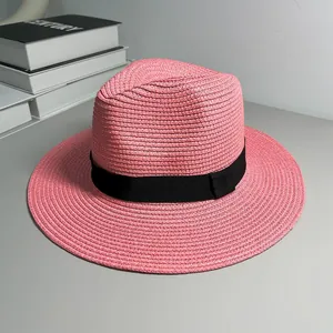 Elegant pink straw Panama fedora hat with black ribbon detail for beach sun protection