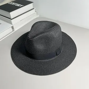 Detailed view of classic black woven Panama straw hat featuring an elegant matching ribbon band.