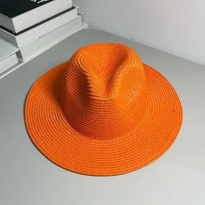 Elegant vibrant orange Panama straw hat perfect for beach sun protection and summer style