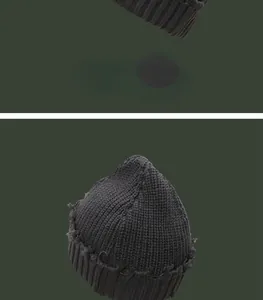 Makroansicht der anthrazitfarbenen Beanie-Mütze mit hochwertiger Stricktextur