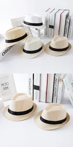 Detailed macro view of classic straw fedora jazz hats for kids in white and beige tones