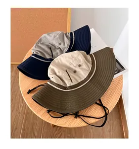 Detailed view of men's wide brim sun protection bucket hat with adjustable cord