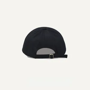 Rear view of washed cotton black baseball cap with adjustable gold buckle strap