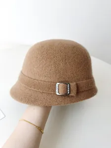 Elegant camel wool felt bucket hat featuring a decorative crystal buckle and soft texture