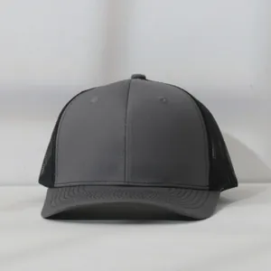 Close-up of grey and black mesh trucker hat with detailed stitching on the brim.