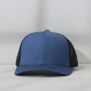 Detailed view of a blue and black mesh trucker baseball cap with breathable design