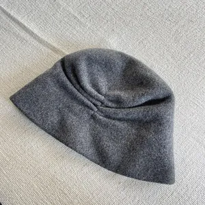 High quality close-up showing the soft texture of grey pure Australian wool bucket hat