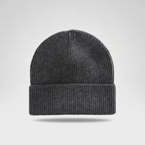 Detailed view of a dark grey ribbed knit beanie with a stylish cuffed hem for winter warmth.