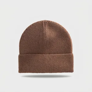 Detailed view of the ribbed texture on a classic brown winter knitted beanie hat