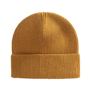 Mustard yellow rib-knit beanie hat for winter warmth with turnover cuff design