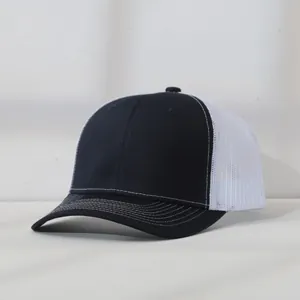 Side view of a black and white mesh trucker hat with contrast stitching details.