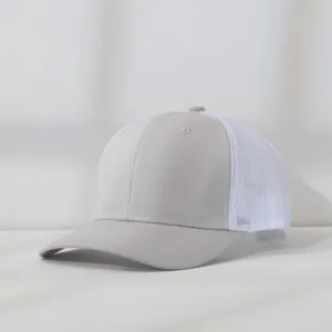 Detailed side view of a light grey and white breathable mesh trucker cap for summer