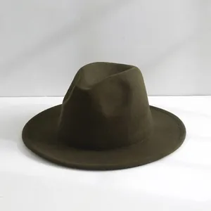Detail shot of a classic olive green wool fedora hat with an elegant wide brim