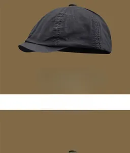 Close-up of vintage charcoal cotton beret cap showing detailed stitching and short brim